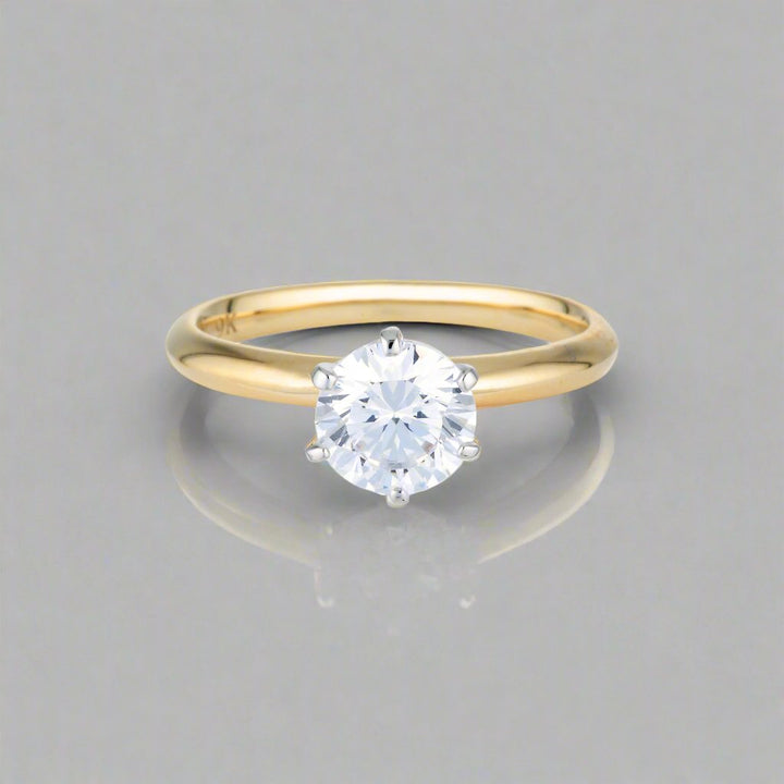 Georgini Gold Round Brilliant Cut 1.25ctw Moissanite Solitaire With Knife Edge Band In Yellow Gold